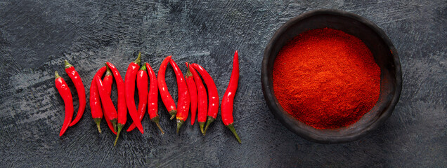 Red chili or chilli cayenne pepper on dark background.