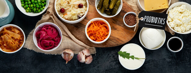 Best sources of probiotic on gray background.