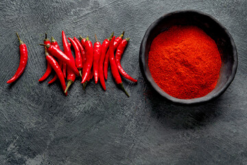 Red chili or chilli cayenne pepper on dark background.