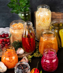 Fermented food on wooden table. High source of probiotics. Front view, copy space