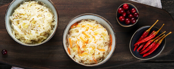 Sauerkraut on wooden background.