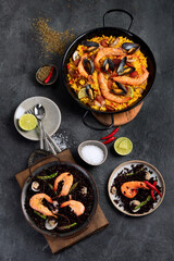 Seafood Paella on gray background.