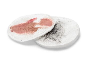 Dirty cotton pads after removing makeup on white background