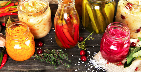 Fermented food on wooden table. High source of probiotics. Front view, copy space