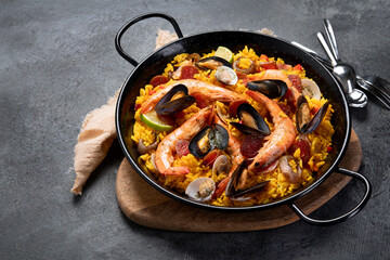 Seafood Paella on gray background.
