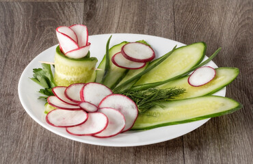salad of thinly sliced and beautifully laid out radishes and cucumbers with herbs