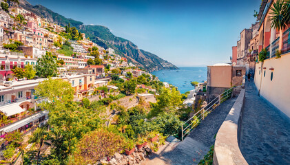 Charming summer cityscape of cliffside village on southern Italy's Amalfi Coast - Positano. Sunny morning seascape of Mediterranean sea. Traveling concept background..