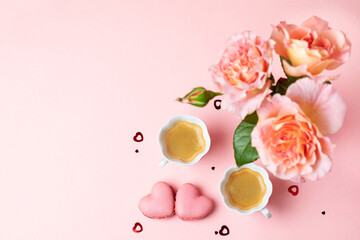 Romantic setup with coffee, macarons and roses