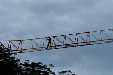 8:03 am, December 7, 2021. Tower Crane disassembly. Disconecting the Working Jib.  Gosford, NSW, Australia.