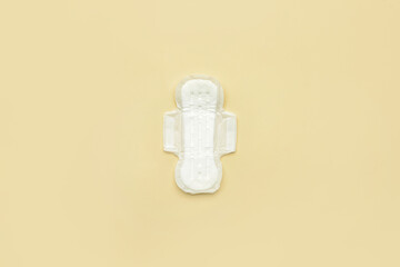 Menstrual pad on yellow background
