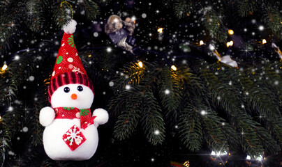 Snowman near the Christmas tree. New Year's decorations. Santa.