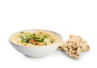 Bowl with delicious hummus and rice crackers on white background