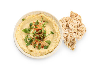 Bowl with delicious hummus and rice crackers on white background