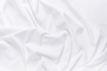 Obraz premium Abstract white fabric texture background. Cloth soft wave. Creases of satin, silk, and cotton.