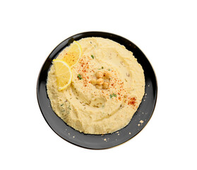 Plate with delicious hummus and lemon on white background