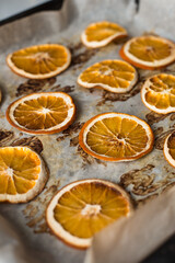 Fototapeta na wymiar Dried orange oranges from the oven. Fragrant citrus slices for decoration.