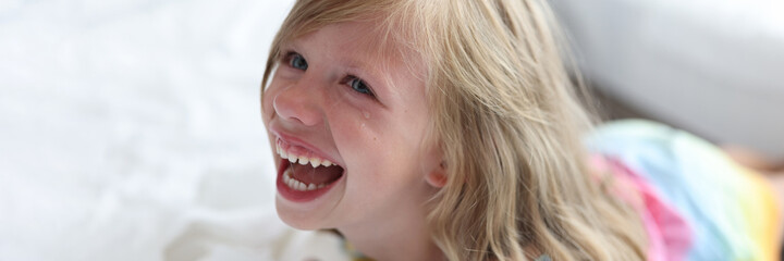 Portrait of crying screaming little girl closeup