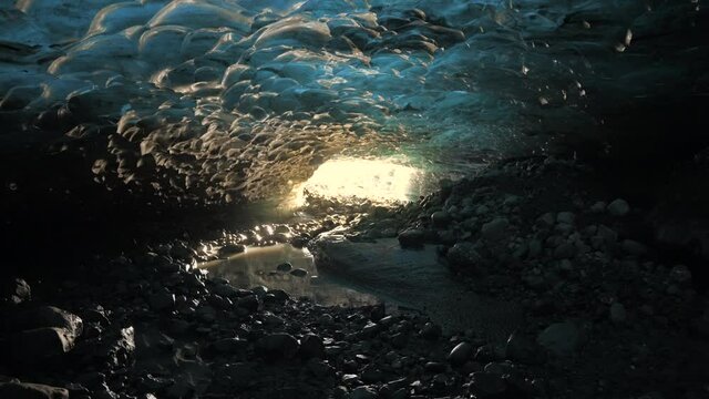Walking inside an ice cave in glacier skaftafell, Vatnaj&ouml;kull National Park. Iceland.
