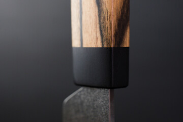 Macro - Exclusive handmade leather craft wooden Skiving knife blade . Close up tanner tool Chartermade. Black background.