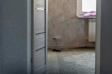 house, interior doors open in a dark corridor