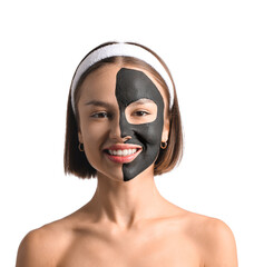 Young woman with activated charcoal mask on her face against white background