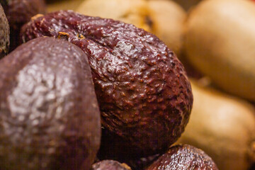 Fruit store, Avocado (Persea americana), ripe at the Boqueria market in Barcelona (Spain).