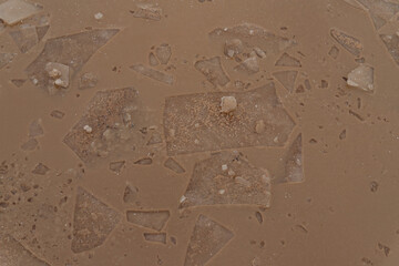 Abstract ice background with cracks on the ice surface