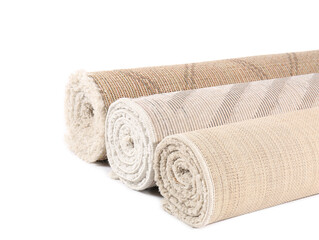 Different rolled carpets isolated on white
