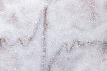 Cardiogram of the heart on a white background of salt