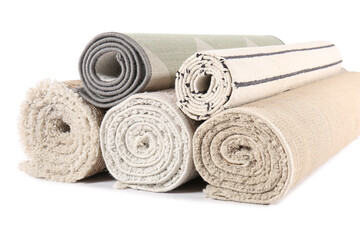 Different rolled carpets isolated on white