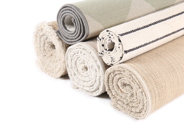 Different rolled carpets isolated on white
