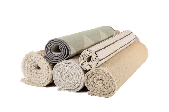Different rolled carpets isolated on white