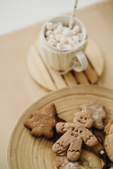 gingerbread and cocoa with marshmallows on the table