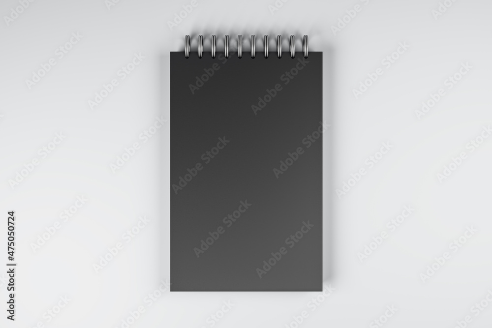 Poster Top view and close up of black spring notepad on white desktop background. Mock up place for your advertisement. Education, work, supplies and stationery concept. 3D Rendering.