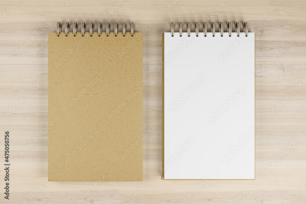 Poster Top view and close up of two white and brown spring notepads on wooden desktop background. Mock up place for your advertisement. Education, work, supplies and stationery concept. 3D Rendering.
