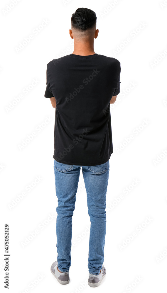 Wall mural Handsome young man in stylish t-shirt isolated on white, back view