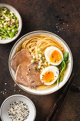 Ramen bowl with egg and pork, asian cuisine food. Top view