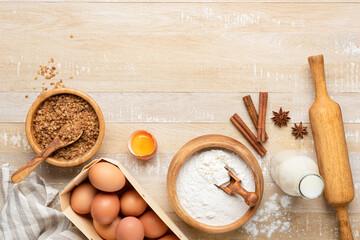 Ingredients for baking a cake on wooden table background, flat lay, copy space for text recipe or...