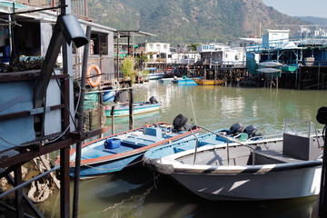 Fototapeta premium Traditional Hong Kong old wooden house, boat and river in countryside