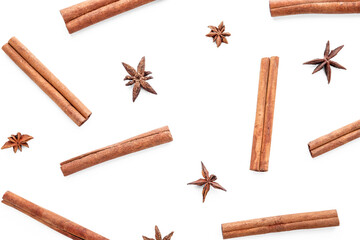 Composition with cinnamon sticks and star anise on white background