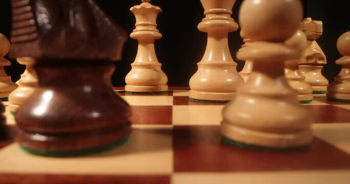 Chess board and pieces close up . Chess figures on chess board macro shot . Slider move, 4k