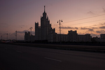 Silhouettes of Stalin's skyscraper on Kotelnicheskaya embankment. Morning urban landscape in the gold hour. Sunrise. Moscow, Russia.