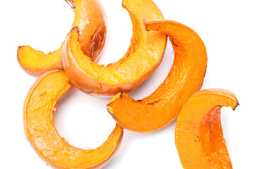 Delicious baked pumpkin pieces on white background