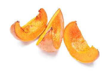 Delicious baked pumpkin pieces on white background