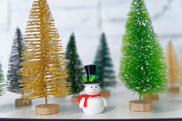 Decoration figurines with snowman and christmas trees