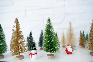 Decoration figurine with snowman, santa and christmas trees
