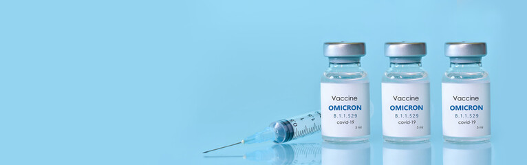 Bottle of Covid-19 vaccine to immunize from the Omicron Variant Coronavirus. The concept of medicine, healthcare and science.Copy space for text.Banner