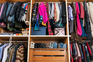 Wardrobe filled with various clothes