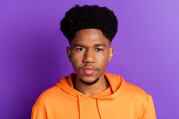 Photo of young handsome african guy serious confident concentrated isolated over purple color background