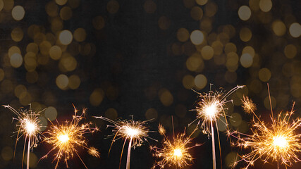 Silvester 2022 New Year New Year's Eve Party background - sparklers fireworks and bokeh light on...